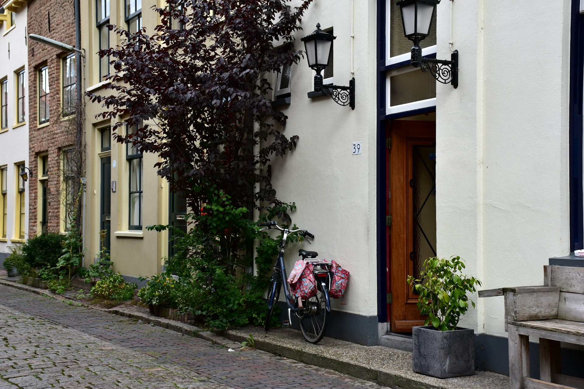 a bicycle is parked next to a building